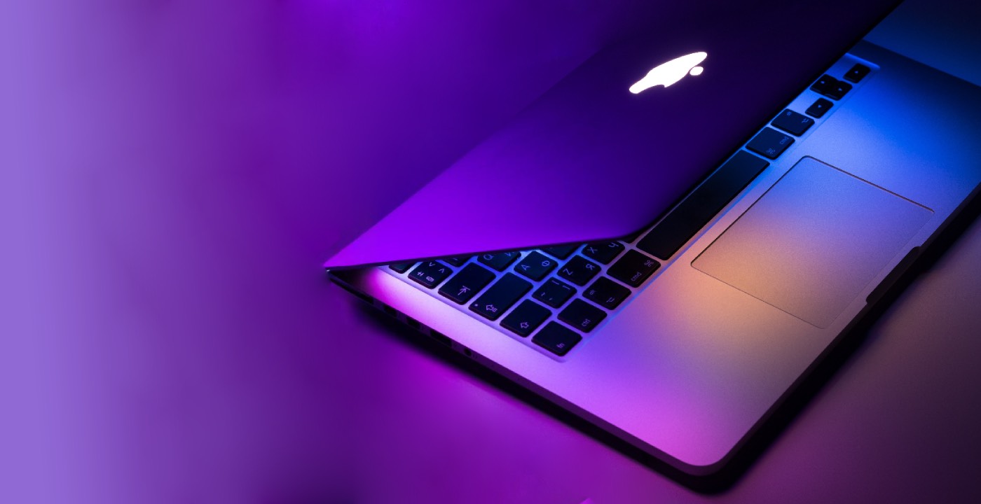 Modern laptop with purple lighting